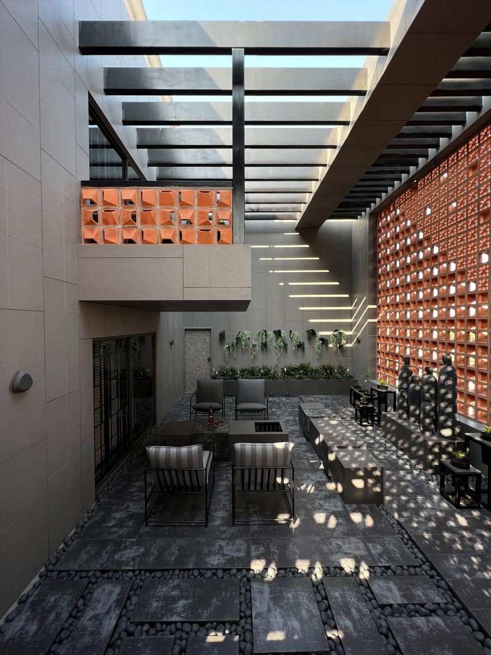 A SYNC project — courtyard with a terracotta jaali screen